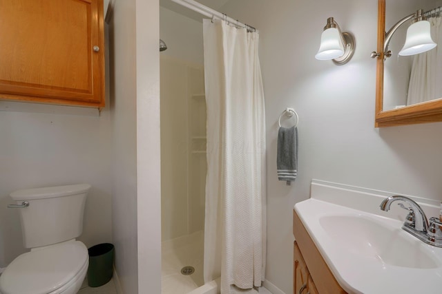 bathroom featuring a shower with curtain, vanity, and toilet