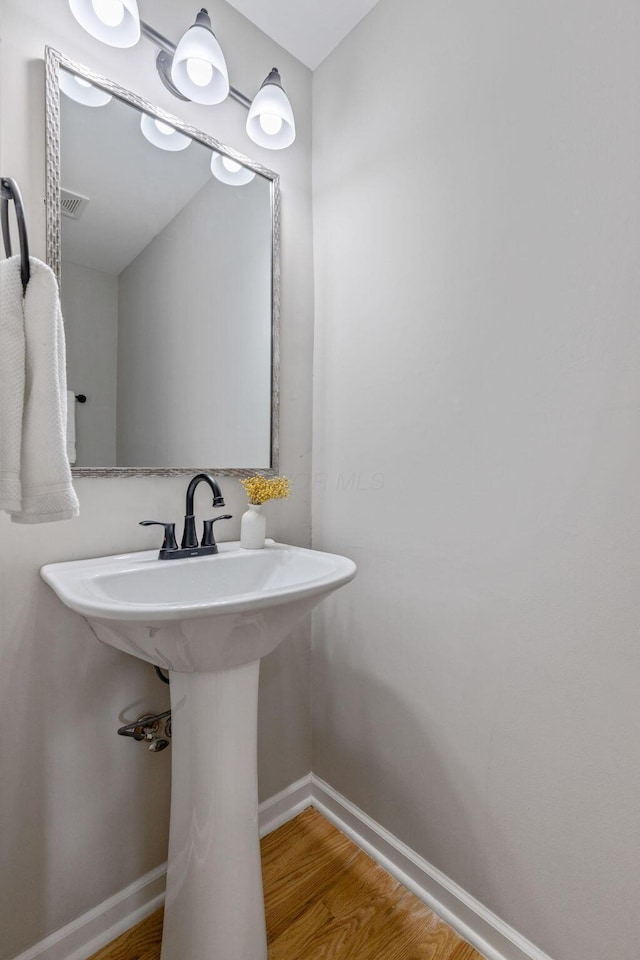 bathroom featuring hardwood / wood-style flooring