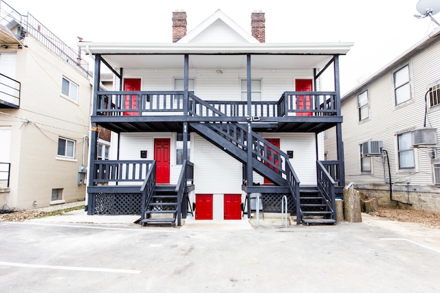 rear view of house with central AC unit