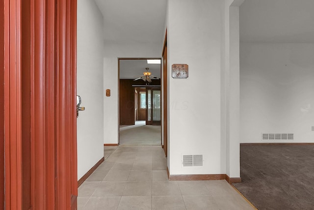 hallway with light tile patterned floors