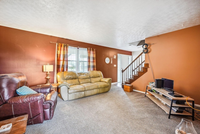 carpeted living room with a textured ceiling