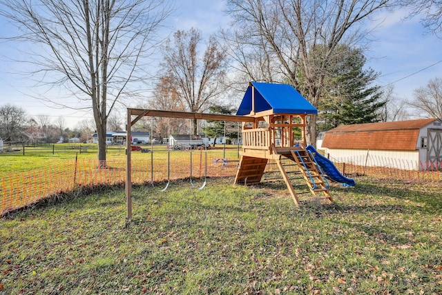 view of jungle gym featuring a lawn