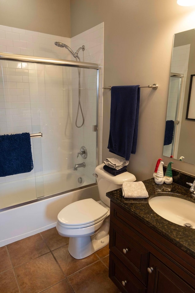 full bathroom with tile patterned floors, vanity, toilet, and enclosed tub / shower combo