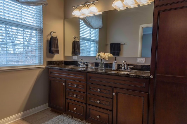 bathroom with tile patterned floors and vanity