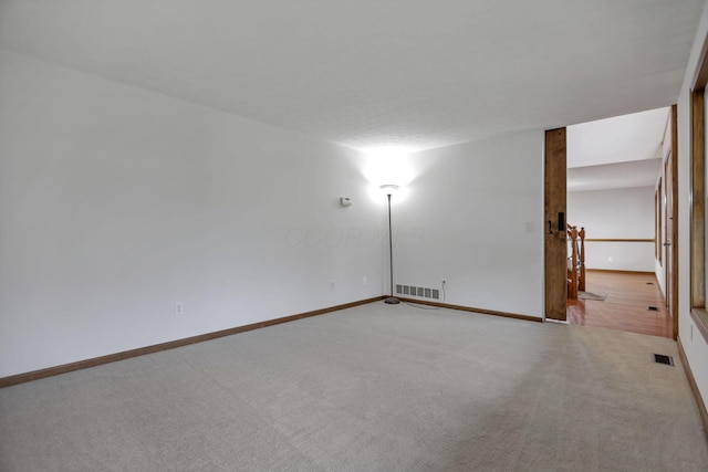 unfurnished room with carpet floors