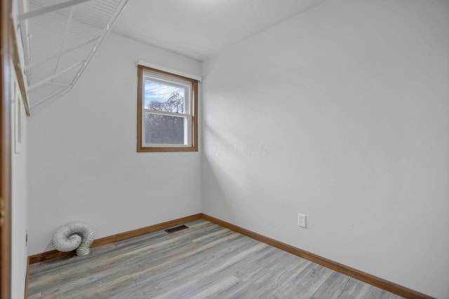 laundry room with light hardwood / wood-style floors