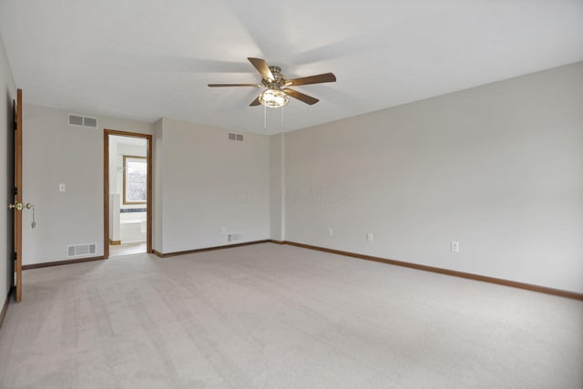 carpeted empty room with ceiling fan