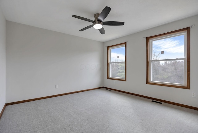 carpeted empty room with ceiling fan