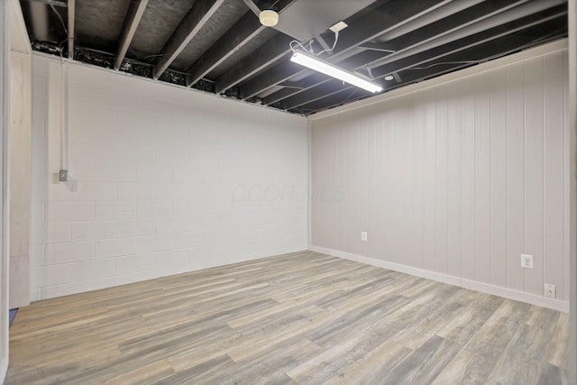 basement featuring light hardwood / wood-style flooring