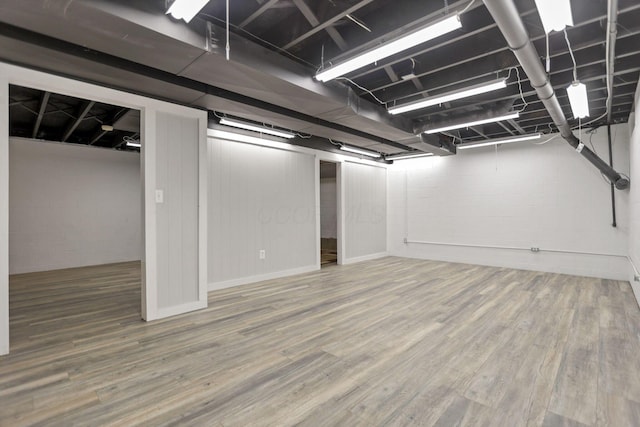 basement featuring hardwood / wood-style flooring