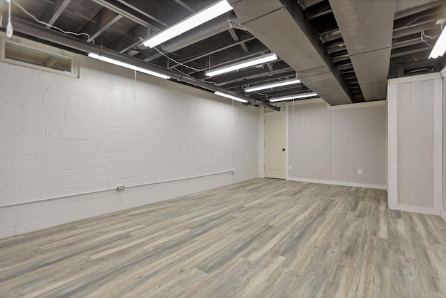 basement with wood-type flooring