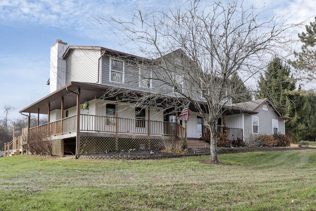 farmhouse featuring a front yard and a porch