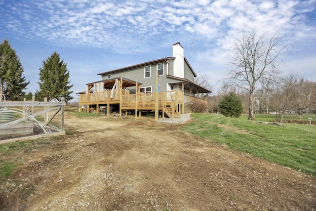 back of house featuring a deck