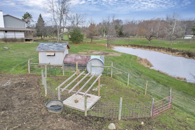 view of yard with a rural view and an outdoor structure