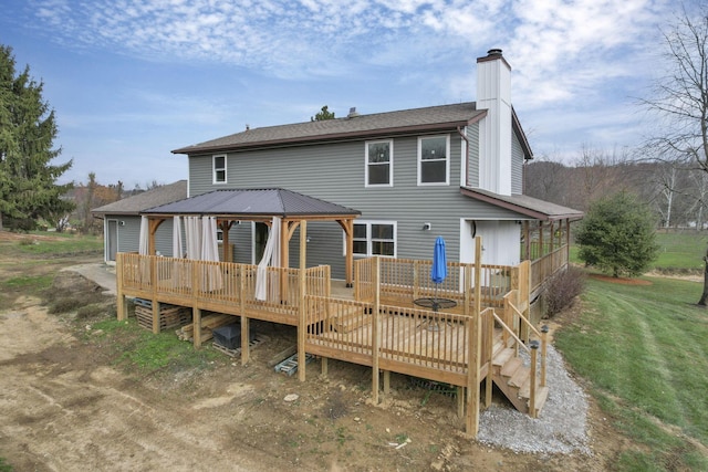 rear view of property with a deck