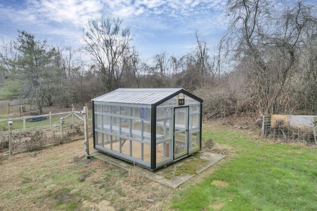 view of outbuilding featuring a yard