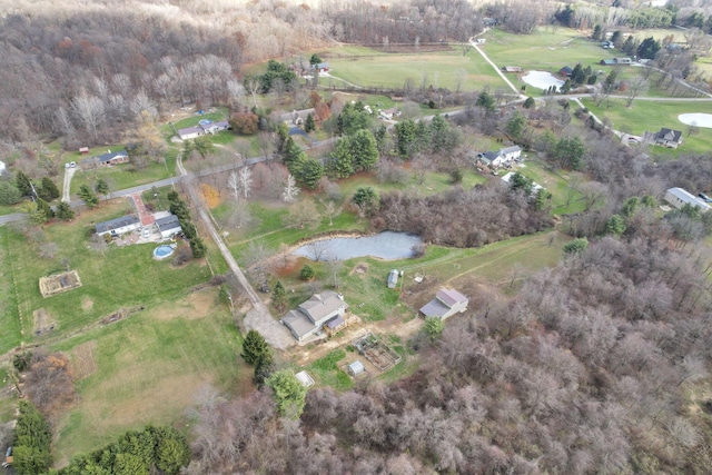 drone / aerial view featuring a water view and a rural view