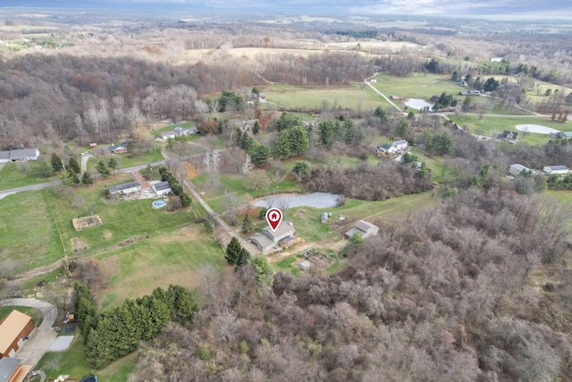 birds eye view of property with a rural view