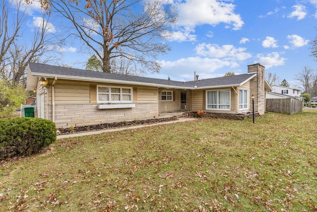 ranch-style house featuring a front lawn