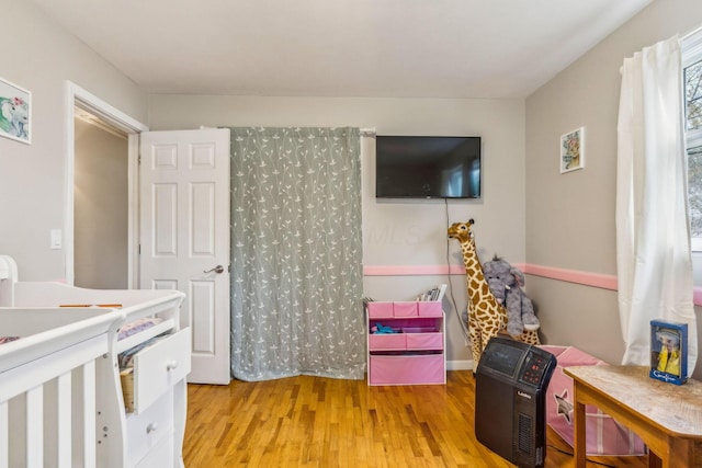 bedroom with light wood-type flooring