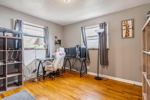 office area with hardwood / wood-style floors