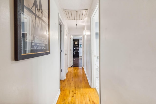 corridor featuring hardwood / wood-style flooring