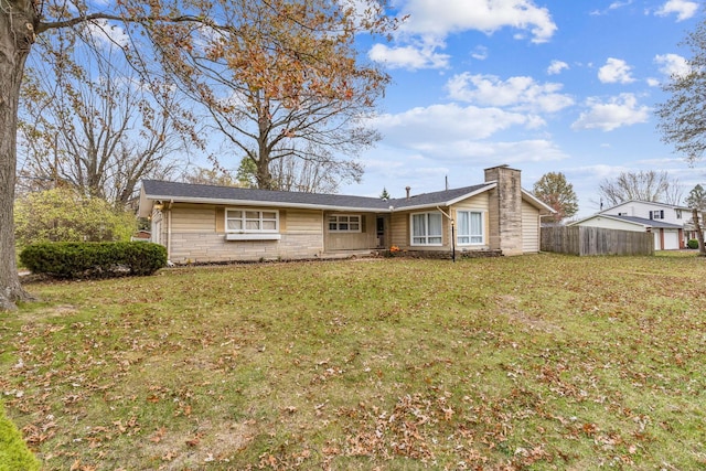 single story home featuring a front yard