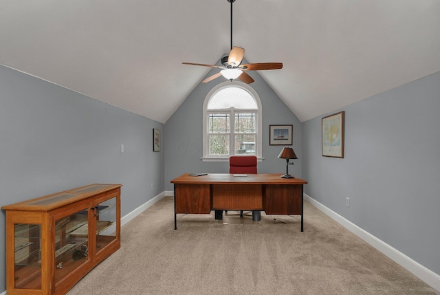 carpeted home office with ceiling fan and lofted ceiling