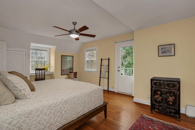 bedroom with hardwood / wood-style floors, ceiling fan, and lofted ceiling