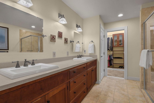 296 Walhalla Rd, Columbus, OH 43202 - full bath featuring a shower stall, a spacious closet, double vanity, and recessed lighting