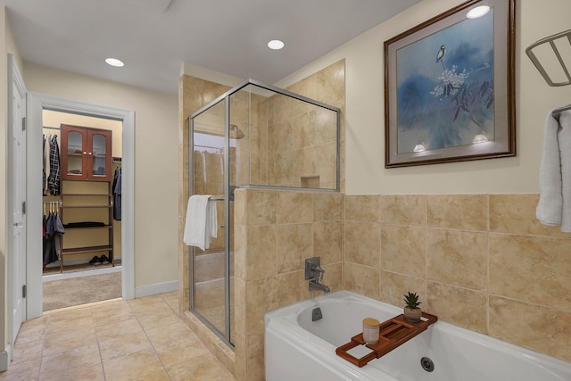 296 Walhalla Rd, Columbus, OH 43202 - bathroom with a whirlpool tub, a shower stall, a spacious closet, and recessed lighting