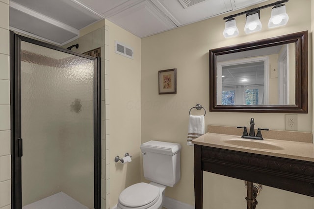 bathroom with vanity, an enclosed shower, and toilet