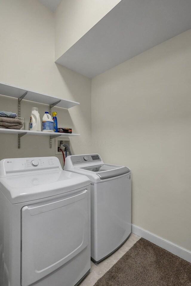 washroom with washer and dryer