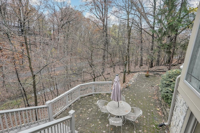 wooden terrace featuring a patio