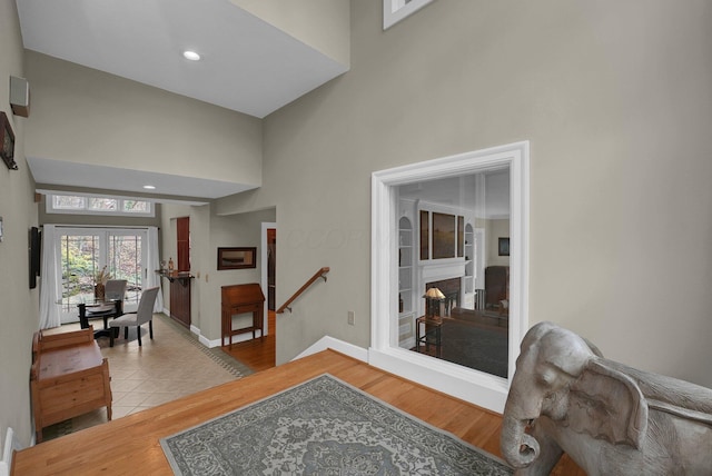 296 Walhalla Rd, Columbus, OH 43202 - entryway featuring a towering ceiling, wood finished floors, a fireplace, and recessed lighting