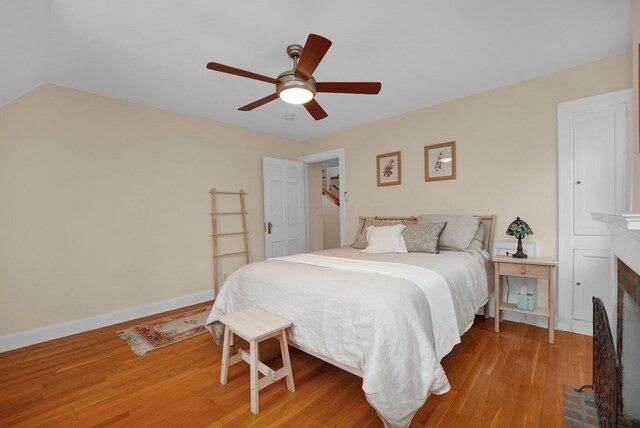 bedroom featuring light hardwood / wood-style flooring and ceiling fan