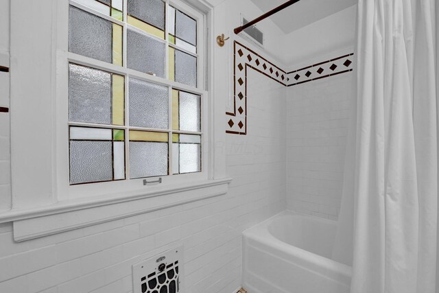 296 Walhalla Rd, Columbus, OH 43202 - full bathroom with shower / bathtub combination with curtain and tile walls