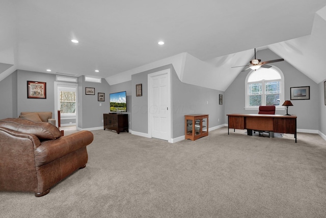 interior space featuring plenty of natural light, ceiling fan, light colored carpet, and vaulted ceiling