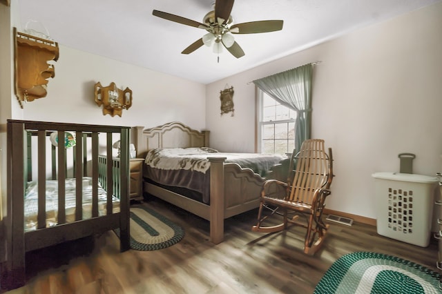 bedroom featuring ceiling fan and hardwood / wood-style flooring