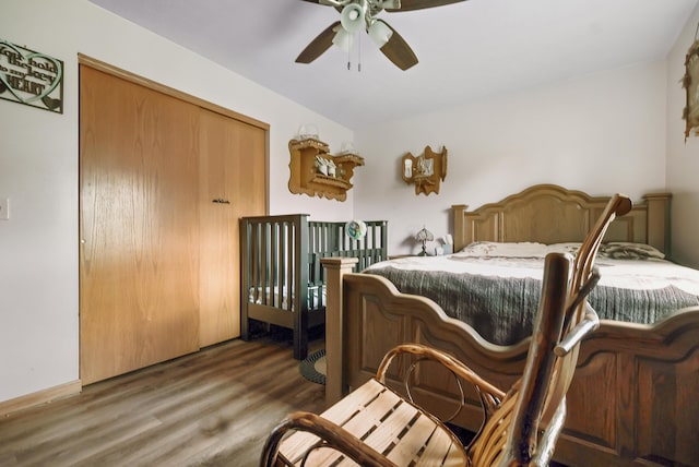 bedroom featuring dark hardwood / wood-style flooring, a closet, and ceiling fan