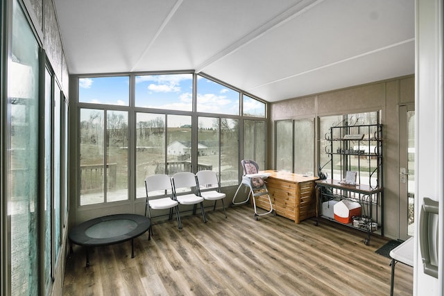 sunroom / solarium with vaulted ceiling