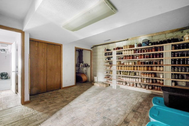 wine room with a textured ceiling