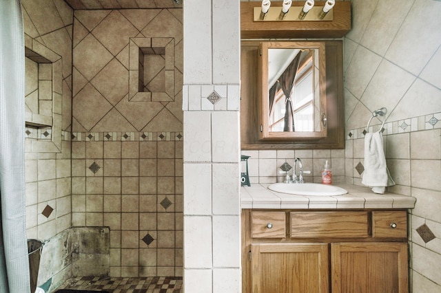 bathroom featuring a shower with curtain, vanity, backsplash, and tile walls