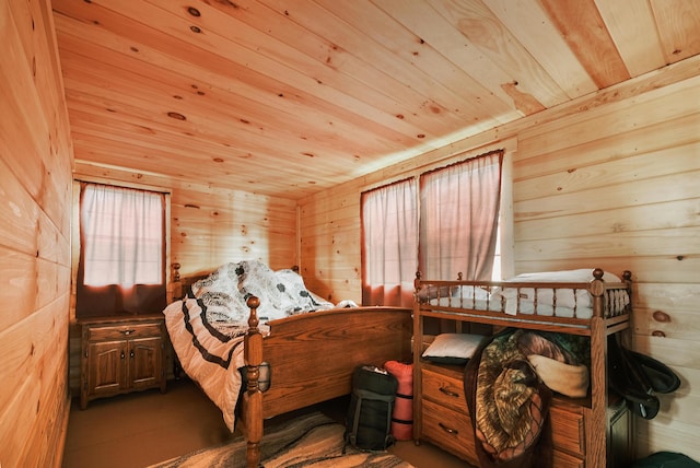 bedroom with wood ceiling and wooden walls