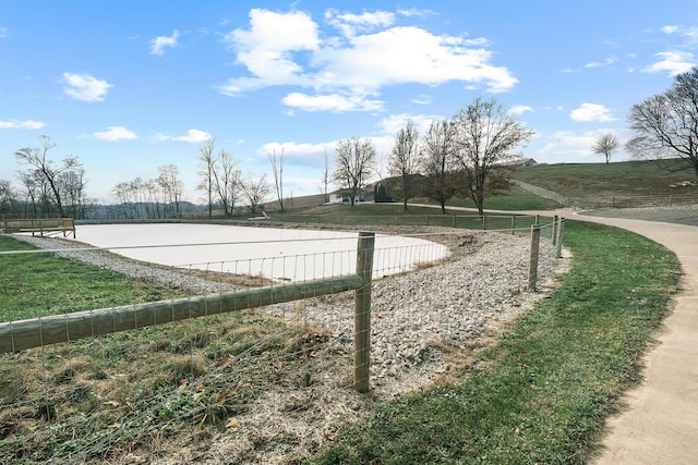 view of home's community with a rural view and a water view