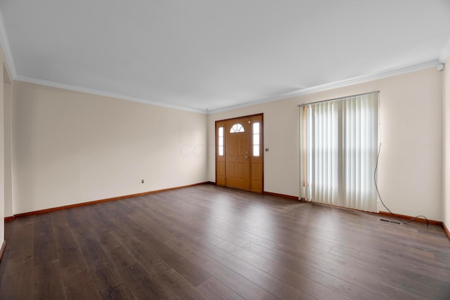 entrance foyer with ornamental molding and dark wood-type flooring