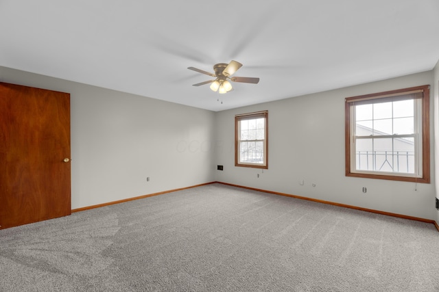 empty room with carpet flooring and ceiling fan