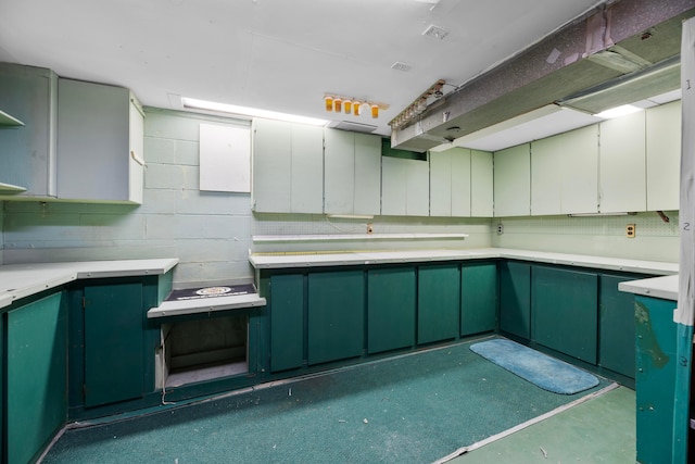 kitchen featuring green cabinets