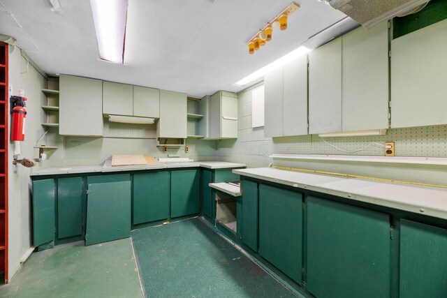 kitchen with green cabinetry