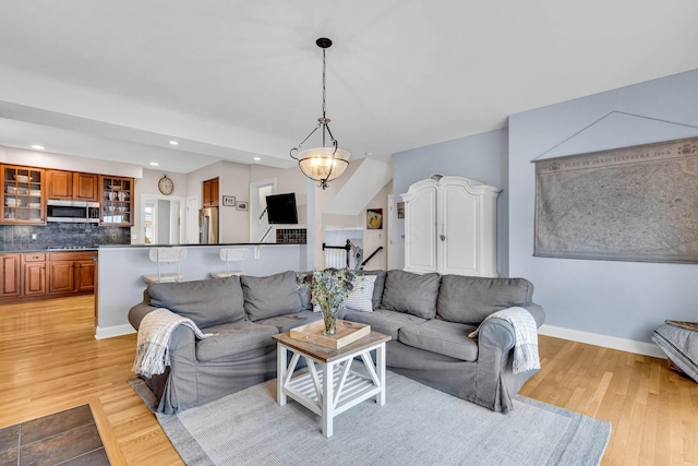 living room with light hardwood / wood-style flooring